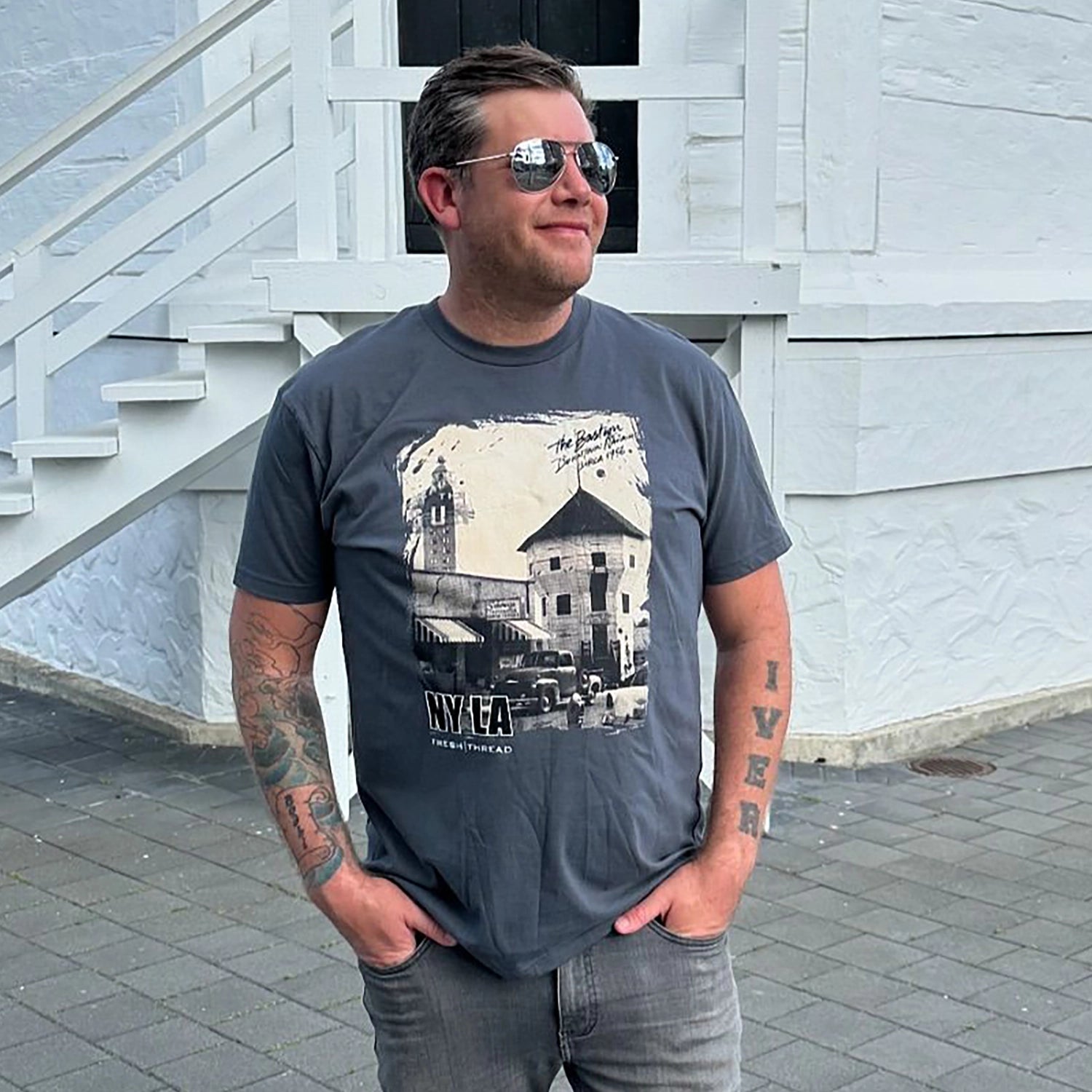 'NYLA Fresh Thread Nanaimo Heritage Tee - Bastion 1956' in 'Asphalt' colour